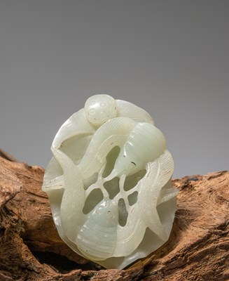 Lot 209 - (R) A LIGHT GREEN JADE CARVING OF A CRAB AND TWO OCTOPUSES, CHINA, 19TH CENTURY, WHITE JADE