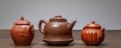 Lot 101 - (R) THREE CHINESE YIXING TEAPOTS, LATE QING DYNASTY