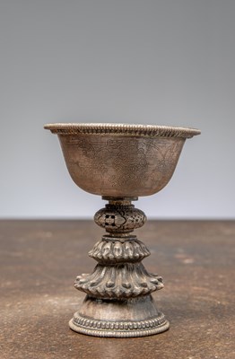Lot 224 - (R) A SILVER EMBOSSED OFFERING LAMP, TIBET, 19TH CENTURY