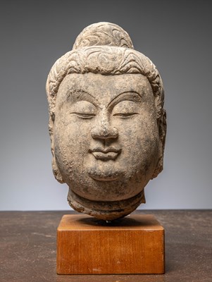 Lot 138 - (R) A BUDDHA STONE HEAD, SANDSTONE, CHINA, NORTHERN QI DYNASTY (550–577), 6TH CENTURY