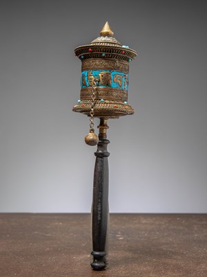 Lot 294 - (R) A TIBETAN HANDHELD PRAYER WHEEL, METAL AND TURQUOISE INLAY, CIRCA 1950