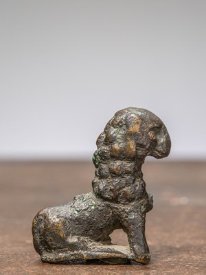 Lot 351 - AN EARLY BRONZE OF AN ANIMAL, INDIA, 14TH CENTURY