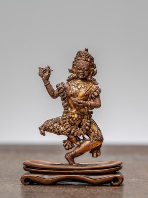 Lot 240 - A STANDING BRONZE VAJRAVARAHI, NEPAL, 14TH CENTURY
