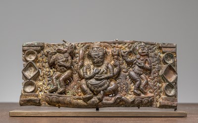 Lot 225 - A COPPER REPOUSSE PLAQUE DEPICTING MAHAKALA, HANUMAN, AND GARUDA , TIBET 13TH CENTURY