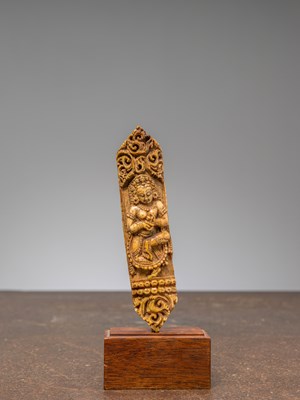 Lot 219 - A BONE CARVING DEPICTING A DANCING CELESTIAL FIGURE (APSARAS),TIBET, 15TH CENTURY