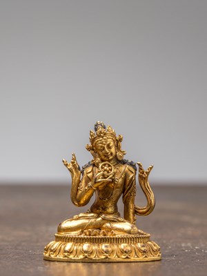 Lot 238 - A SMALL GILT-BRONZE SEATED BODHISATTVA, TIBET OR CHINA, 18TH-19TH CENTURY