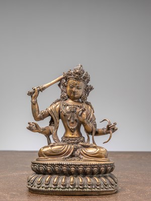 Lot 175 - A FOUR-ARMED BODHISATTVA,GILDED COPPER, YONGLE PERIOD, MING DYNASTY