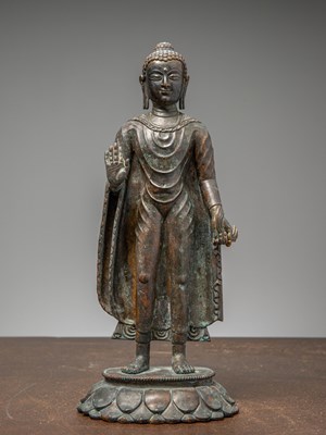 Lot 296 - A STANDING BRONZE BUDDHA, TIBET, 12TH CENTURY