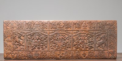Lot 229 - A WOOD CARVED BOOKCOVER, TIBET, 18TH CENTURY